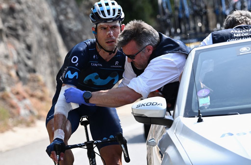 Movistar Teams Spanish rider Imanol Erviti receives a medical assistance during the first stage of the 74th edition of the Criterium du Dauphine cycling race 192 km between La VoultesurRhone and Beauchastel on June 5 2022 Photo by Marco BERTORELLO AFP Photo by MARCO BERTORELLOAFP via Getty Images