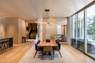 Living space with slatted wooden screens and wood floor