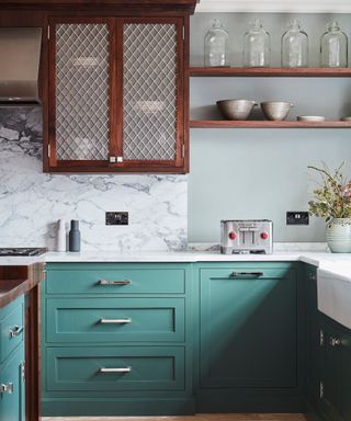 Mix silver hardware styles in a wood and blue kitchen