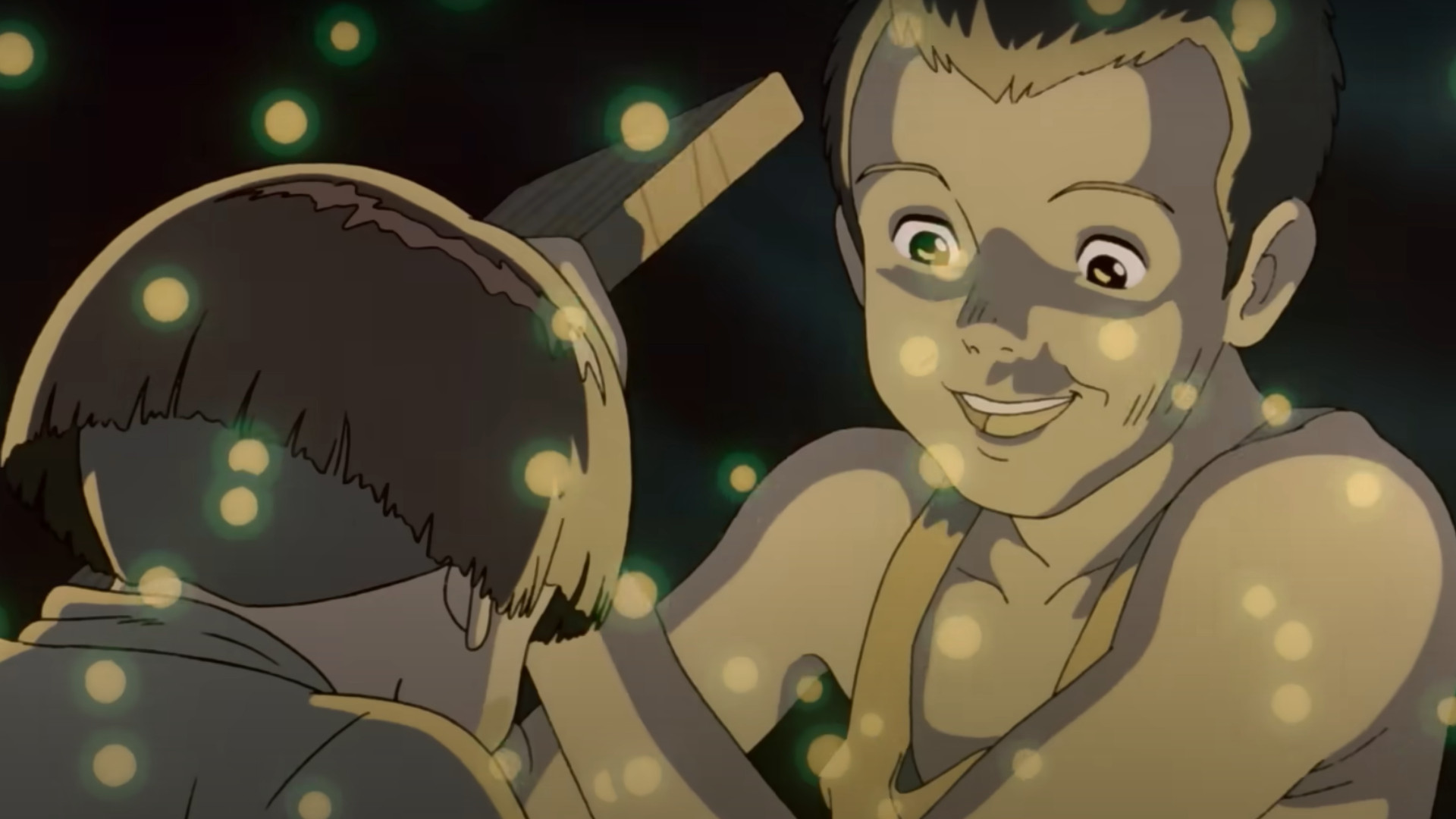 Seita and his sister Setsuko opening a wooden box containing fireflies at night in the anime movie Grave of the Fireflies.