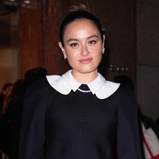 Chase Sui Wonders wearing a white-collar black jacket with a miniskirt