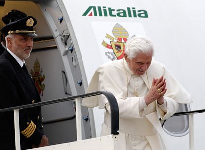 Pope flies home