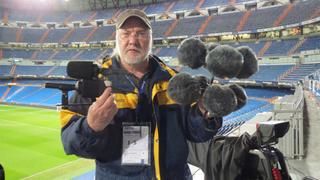 Dennis Baxter gathers microphones after a test event in Madrid, Spain.
