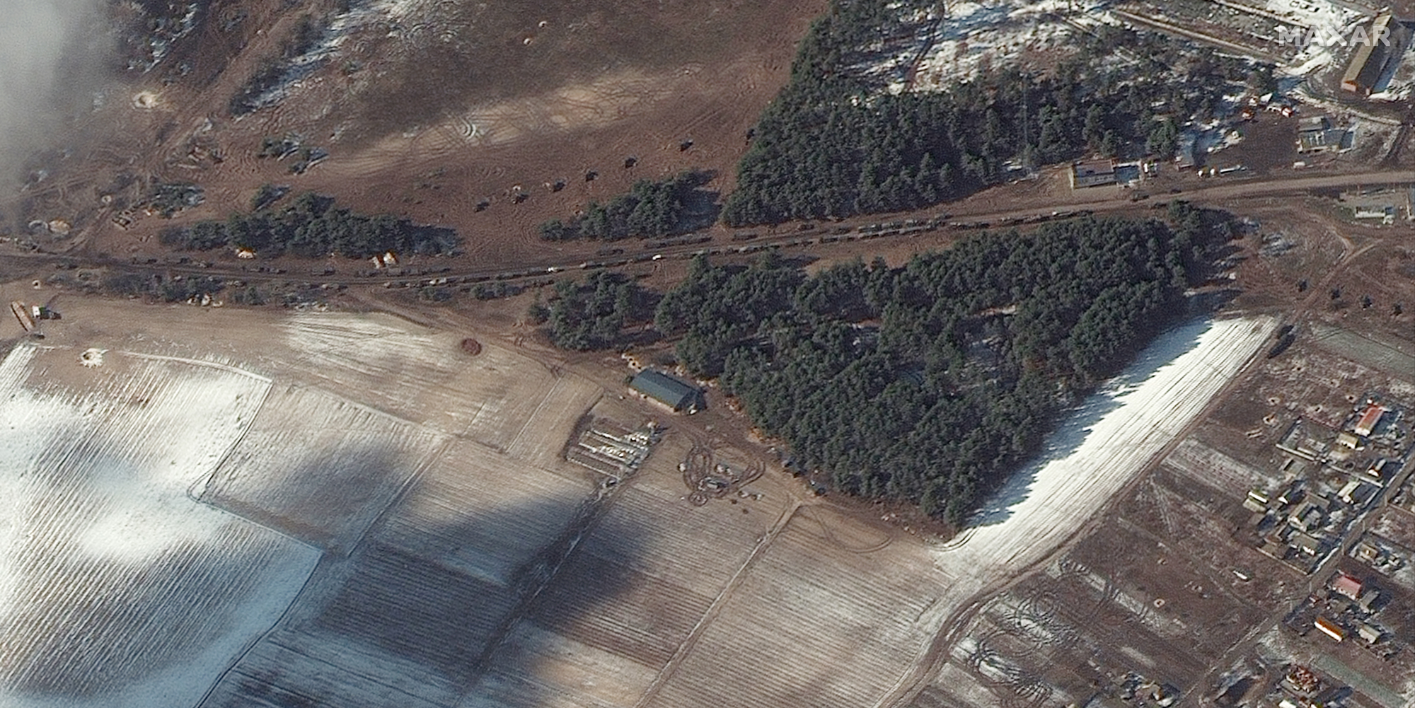 Resupply trucks and probable multiple rocket launchers in firing position near Berestyanka in the Kyiv region of Ukraine are visible in this Maxar satellite image taken on March 10, 2022.