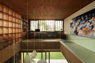Wood-lined, double-height space in South Jakarta home