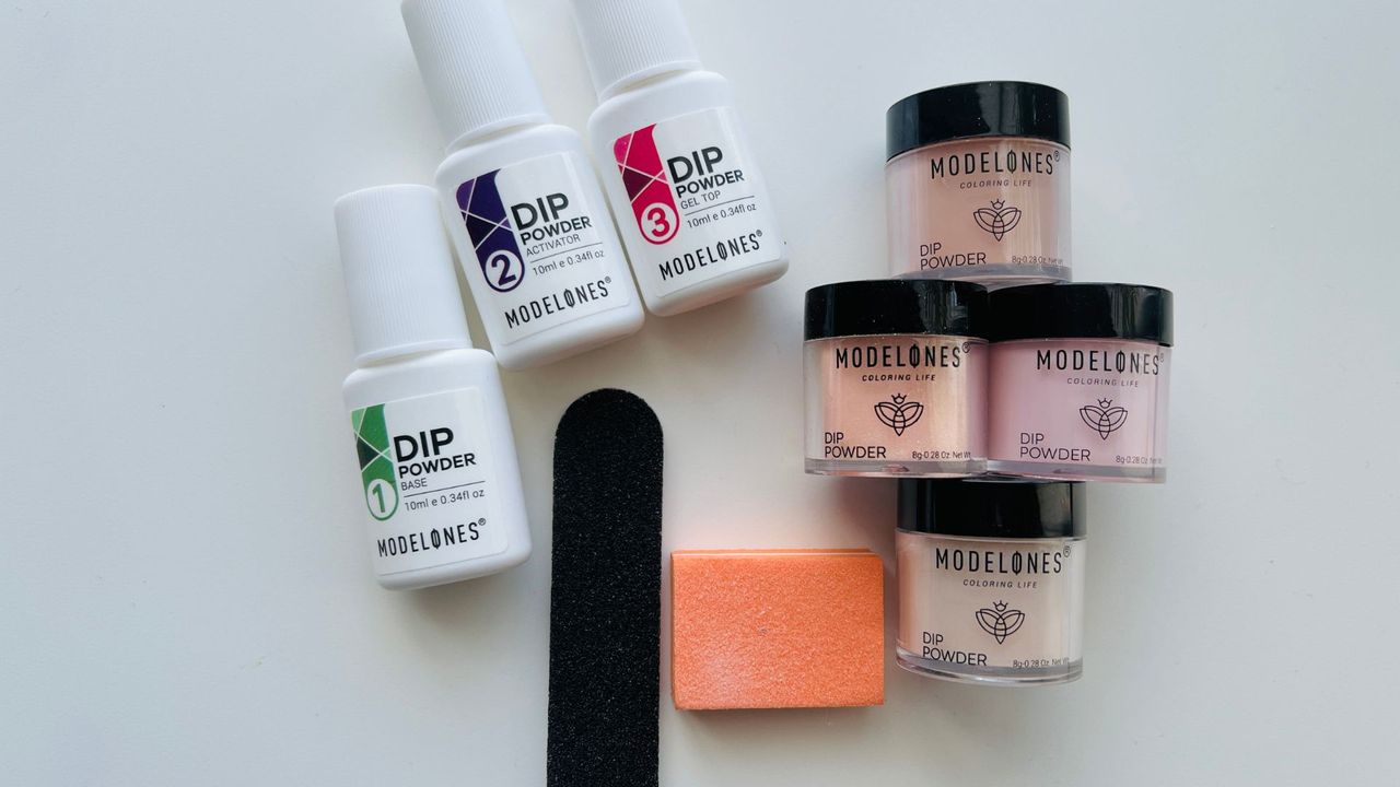 An opened Modelones Dip Powder Nail Kit Starter on a white for the best dip powder nail kits.