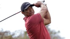 Tiger Woods takes a shot at the PNC Championship