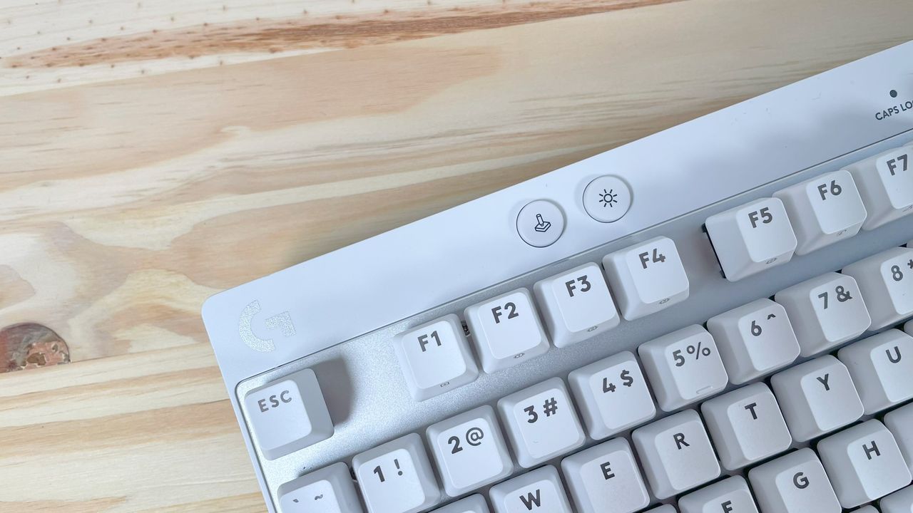 Close up of the Game Mode button on the white Logitech G PRO X TKL Rapid gaming keyboard