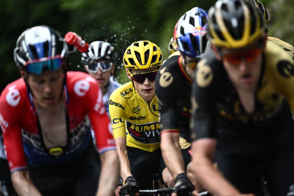 Jumbo-Visma's Danish rider Jonas Vingegaard wearing the overall leader's yellow jersey cycles in the ascent of the Col de la Ramaz during the 14th stage of the 110th edition of the Tour de France cycling race, 152 km between Annemasse and Morzine Les Portes du Soleil, in the French Alps, on July 15, 2023. (Photo by Marco BERTORELLO / AFP)