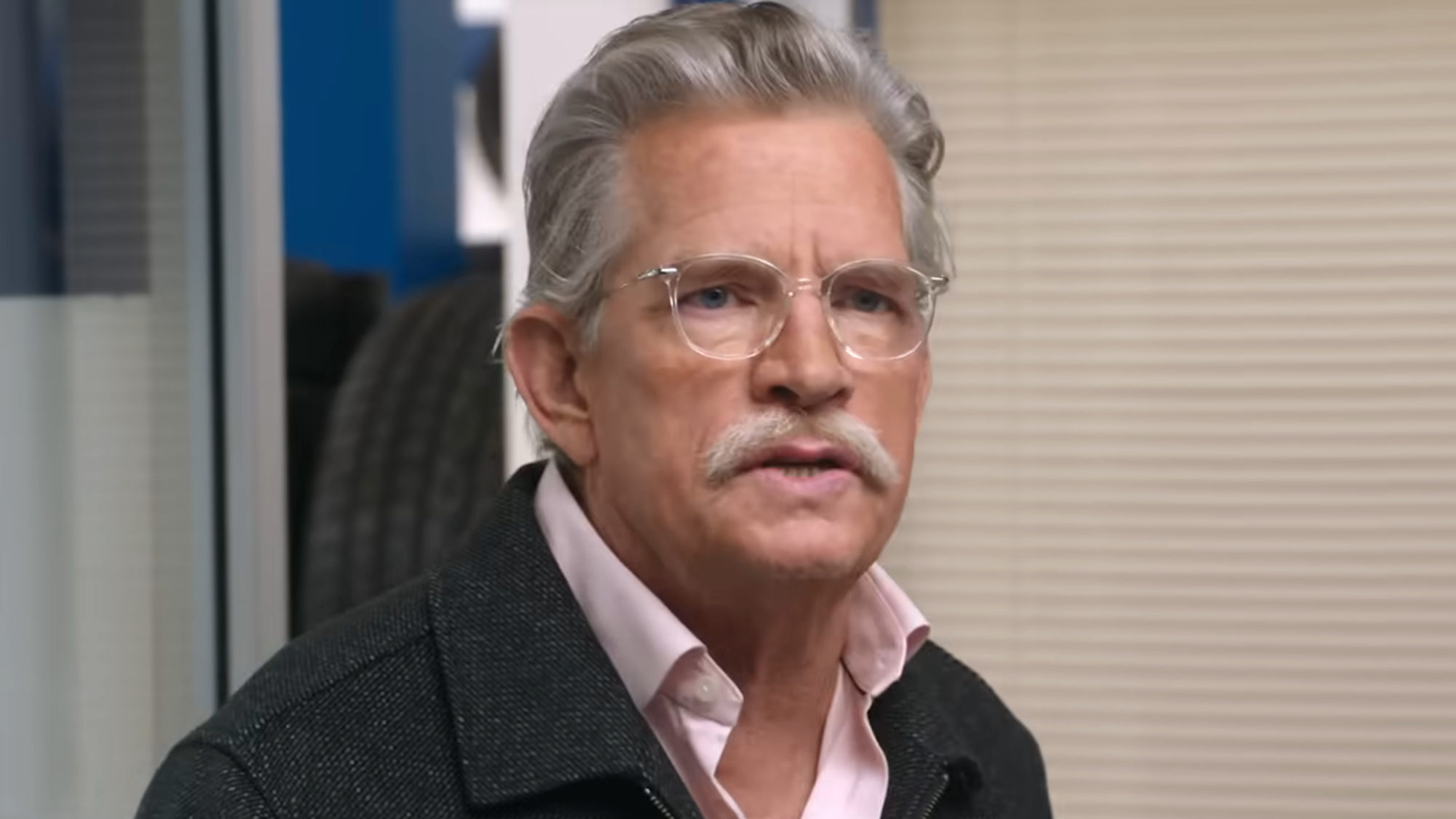 Thomas Haden Church talks in his office during an episode of Tires.