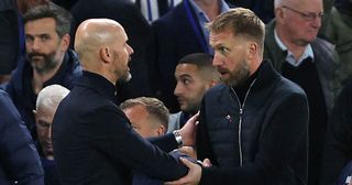 Chelsea head coach Graham Potter and Manchester United manager Erik ten Hag shake hands after the English Premier League football match between Chelsea and Manchester United at Stamford Bridge in London on October 22, 2022.