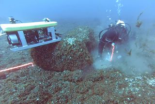 Diver Inspects Ancient Hunting Site