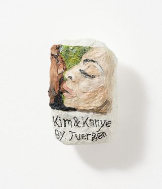 stone painted with Kim & Kanye;s faces