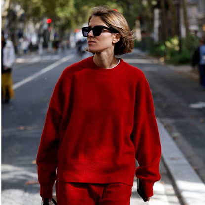 PARIS, FRANCE - OCTOBER 04: A guest wears red jumper, red trousers, brown Herm&egrave;s bag, outside Herm&egrave;s, during the Womenswear Spring Summer 2026 as part of Paris Fashion Week on October 04, 2025 in Paris, France. (Photo by Claudio Lavenia/Getty Images)