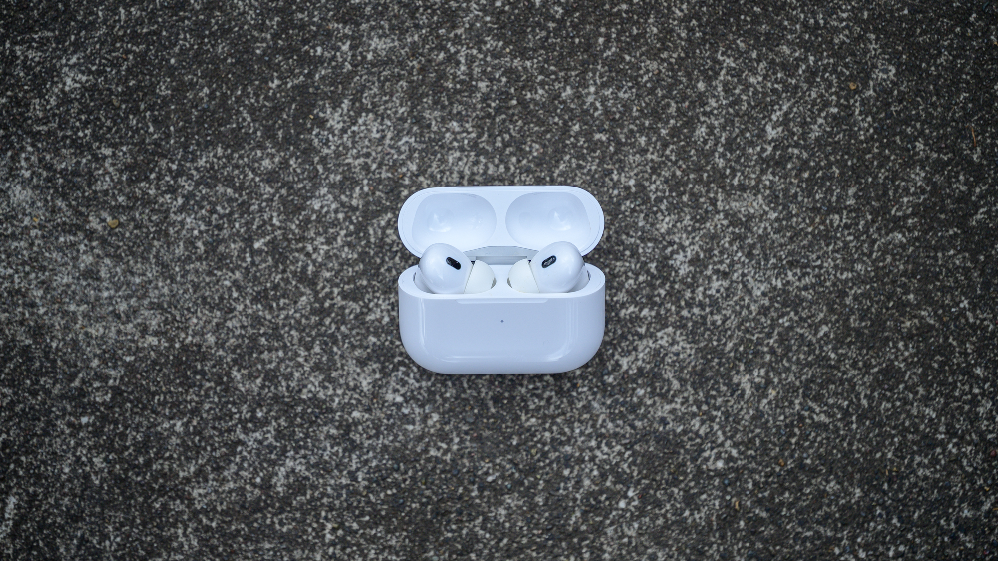 Apple airpods pro 2 on a stone worktop