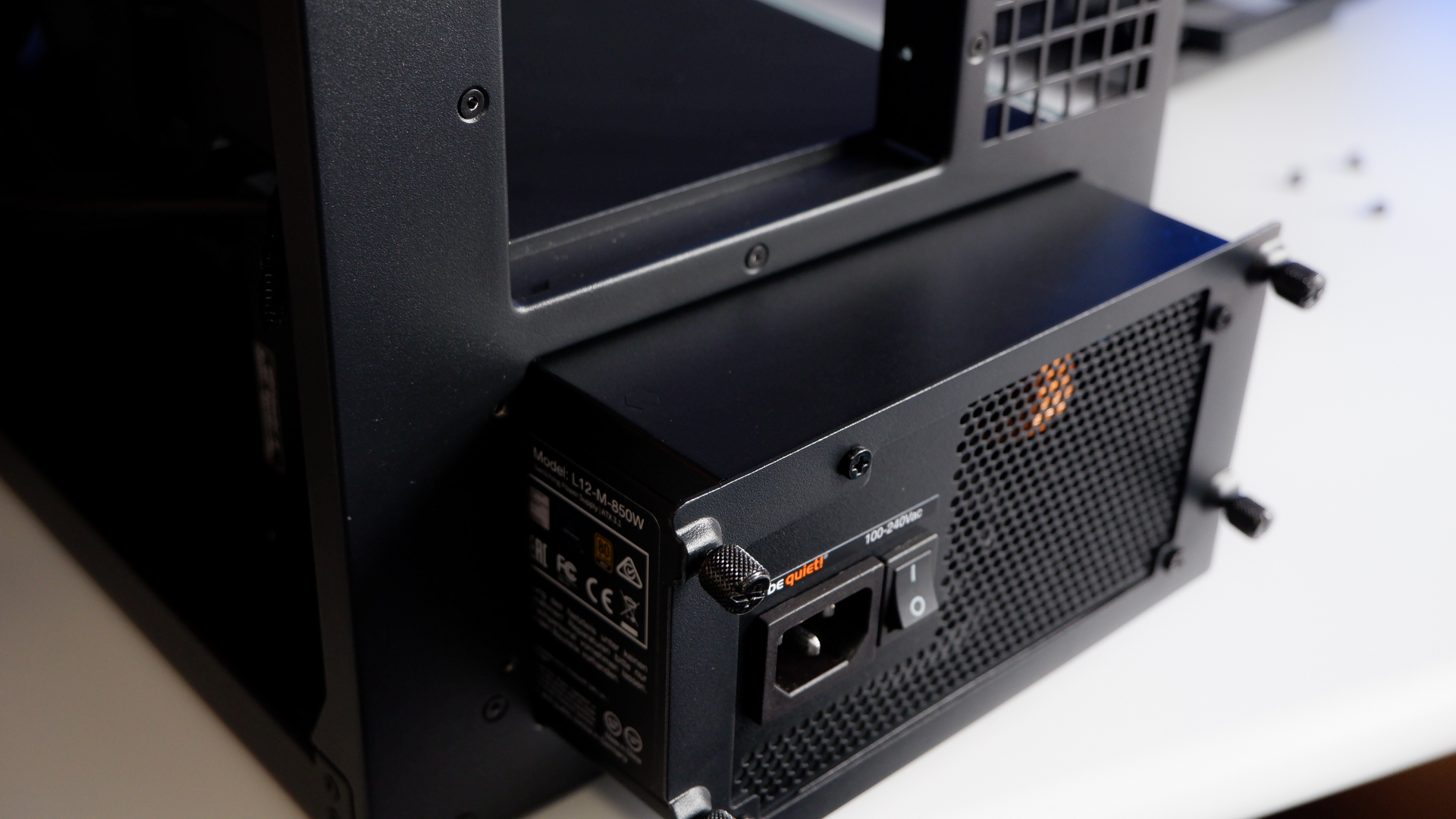 Arctic's Xtender PC case on a white desk with various parts being installed to build a functional gaming PC.