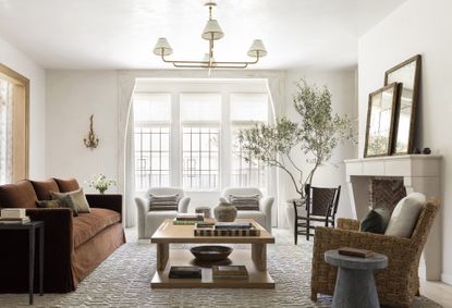 white living room with velvet rust sofa by Marie Flanigan