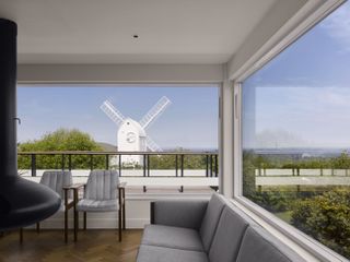 Architecture - The Jack Windmill and Mill House in Clayton, West Sussex. FIGURE 6: Peter Farley 's 1960's 'pier' projecting into the garden. Jack aligns with the steel-clad turret. Photograph: Will Pryce / Country Life Picture Library