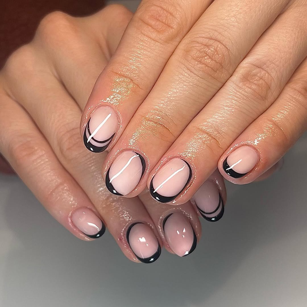 a person wearing a black outline french manicure