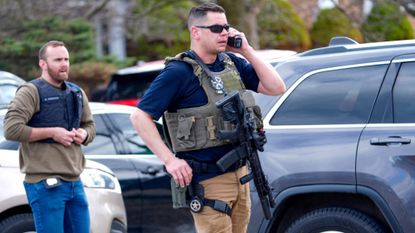 Armed police officers respond to an attack at a Michigan synagogue.