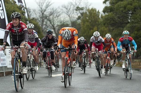 The peloton rolls over the finish atop the You Yangs on stage two.