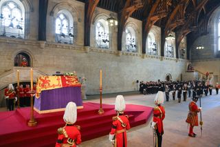 King Charles III, Anne, Princess Royal, Prince Edward, Earl of Wessex, Prince William, Prince of Wales, Prince Andrew, Duke of York, Camilla, Queen Consort, Sir Timothy Laurence, Mr Peter Phillips, Sophie, Countess of Wessex, Catherine, Princess of Wales, Princess Beatrice and Prince Edward, Duke of Kent are seen inside the Palace of Westminster as the First Watch begins their duty during the Lying-in State of Queen Elizabeth II on September 14, 2022 in London, England.