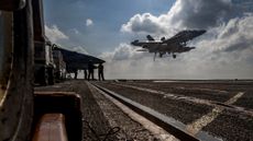 Fighter jet takes off from U.S. aircraft carrier Abraham Lincoln