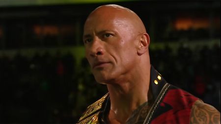 The Rock in Final Boss match with Cody Rhodes and Roman Reigns 2025, looking at the camera.