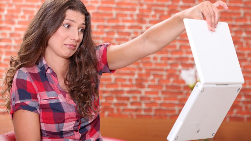 Woman disgusted by her laptop