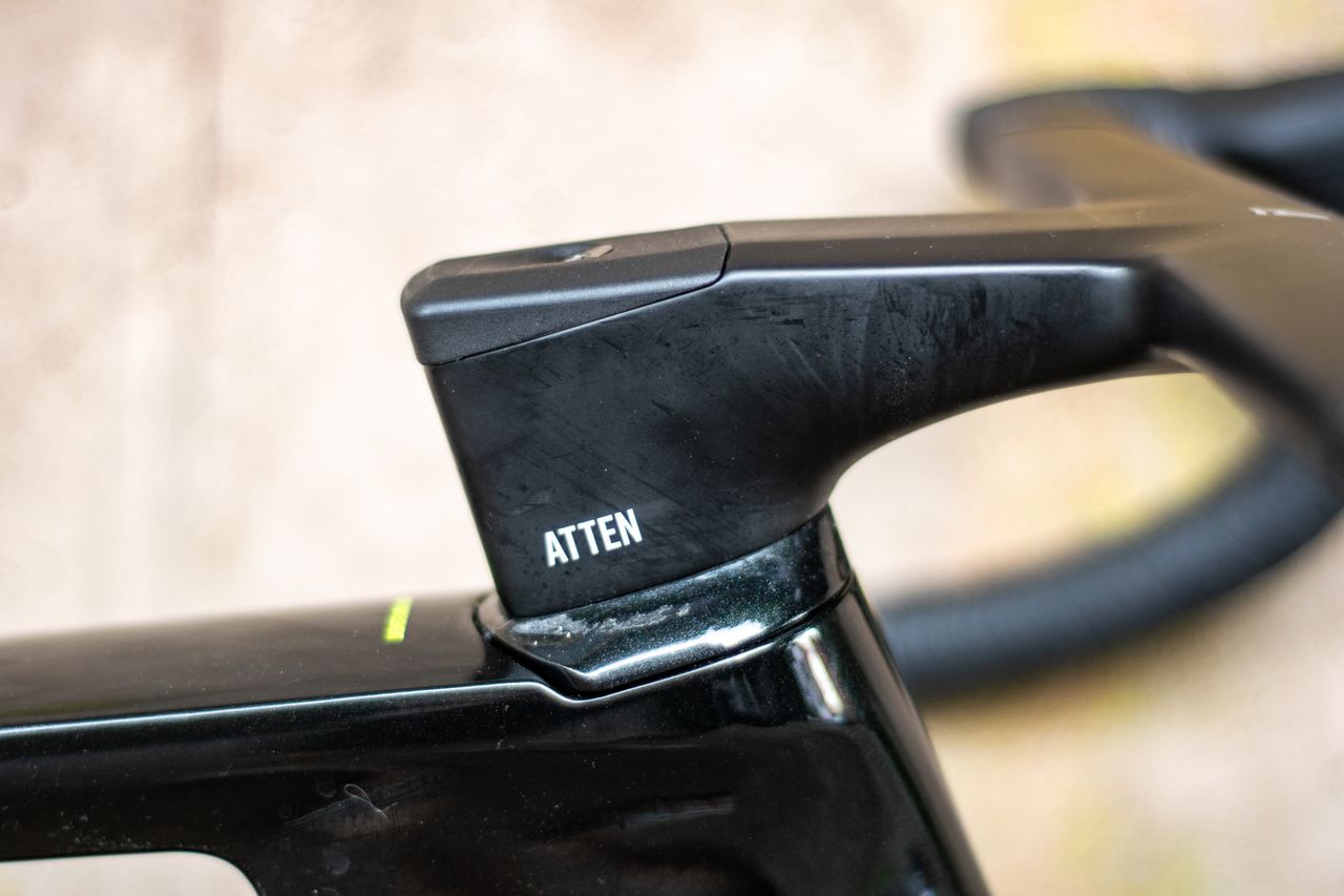 An Argon 18 Anti Matter gravel bike leaning against a concrete wall.
