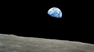 Blue and white planets seen from the surface of the grey dusty moon