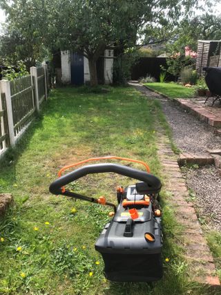 mowing a small lawn with a Worx cordless lawn mower