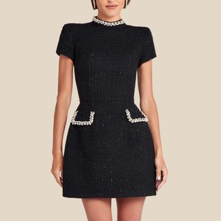 flat lay image of black boucle dress