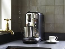 Close up of nespresso creatista plus by sage, being used to make a coffee