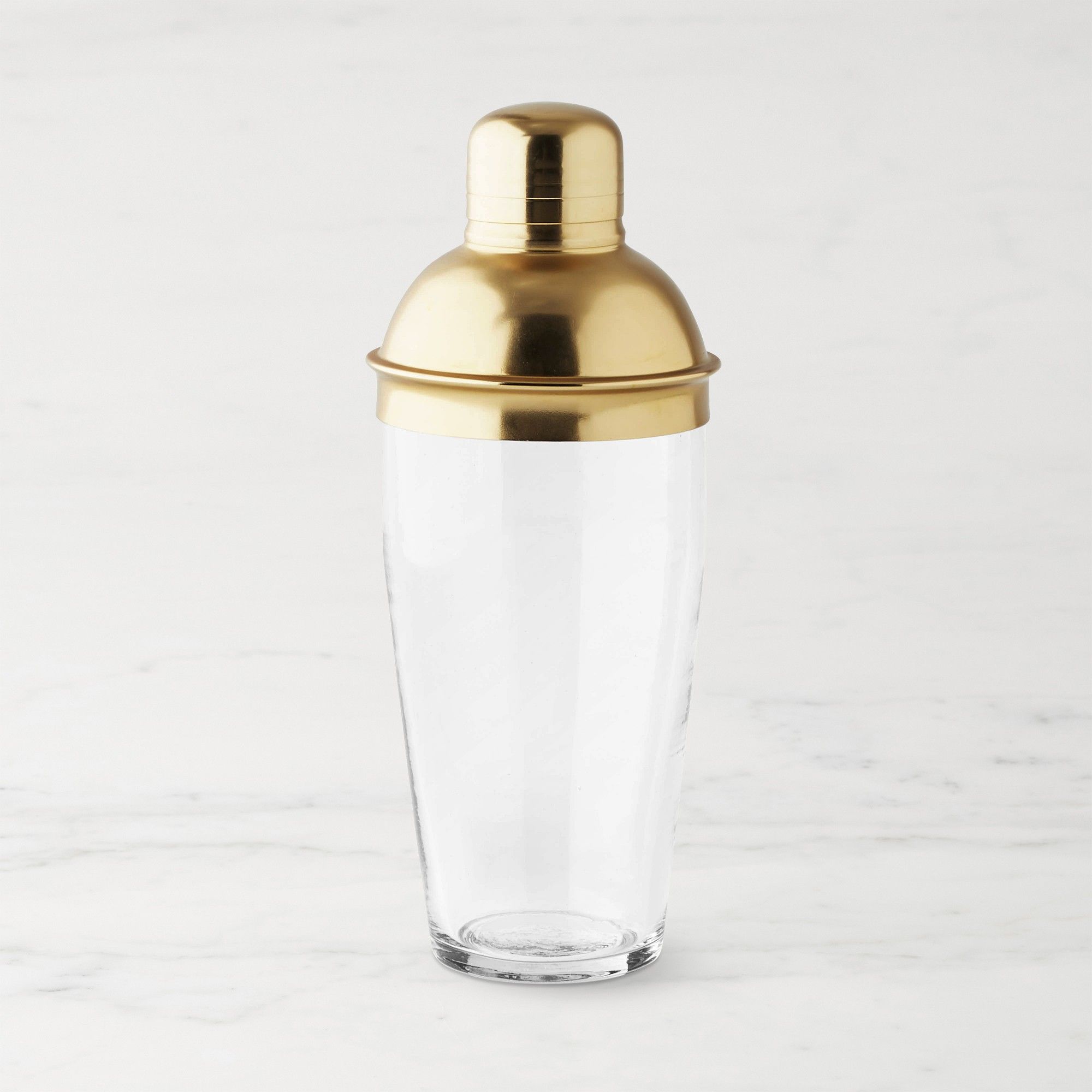 Glass cocktail shaker with brass lid
