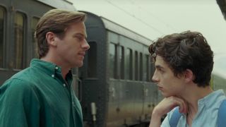 Armie Hammer and Timothee Chalamet looking at each other by the train station in Call Me By Your Name