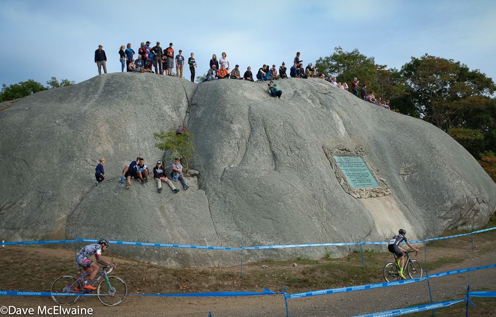 Spectators atop the big rock at Stage Fort Park watch Tobin Ortenblad (Santa Cruz/Donkey Label) and Anthony Clark (Squid Squad) during lap two