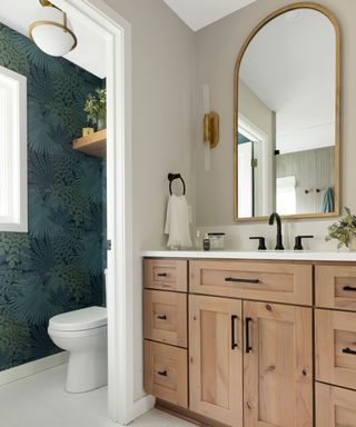 Beige bathroom with dark green wallpaper