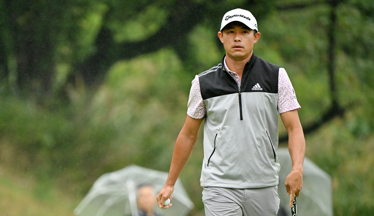Collin Morikawa walks off the green