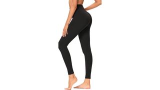 A model wearing black high-waisted leggings for the best leggings on Amazon.
