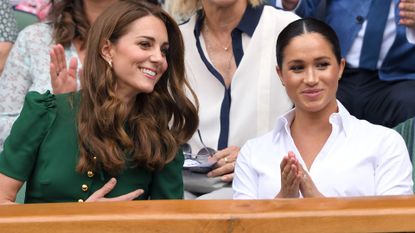 Catherine, Duchess of Cambridge and Meghan, Duchess of Sussex in the Royal Box on Centre Court