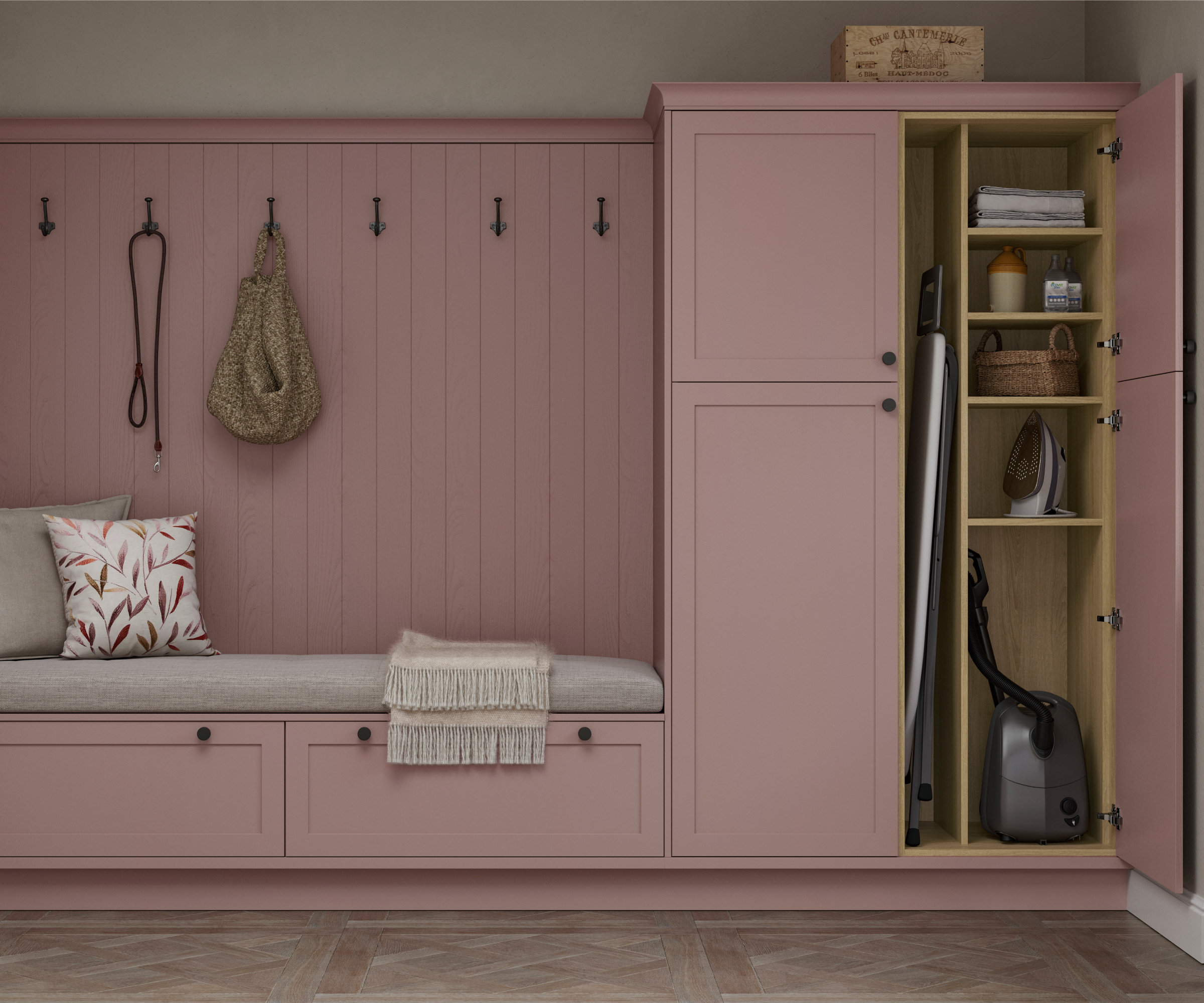 pink built in boot room storage with tall cupboards to one side of long seat with panelled back and hooks, storage drawers below seat
