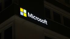 Microsoft logo illuminated on the side of a building a night time in Tromso, Norway.