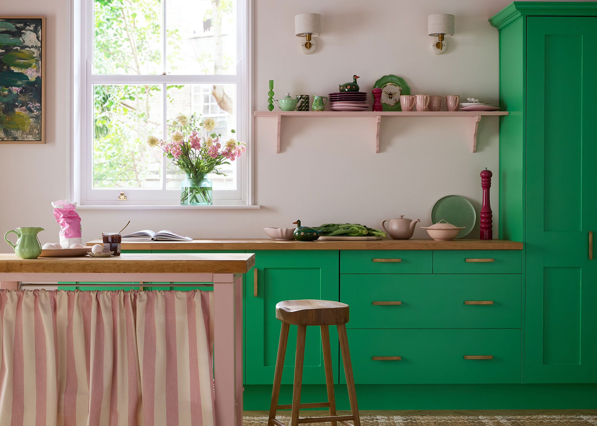 bright green kitchen with pink kitchen island and pink walls