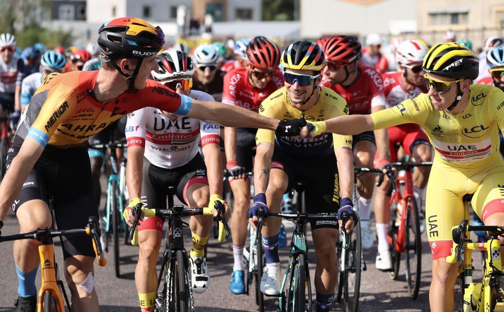 Team UAE Emirates rider Slovenias Tadej Pogacar R wearing the overall leaders yellow jersey is greeted by Team Bahrain rider Slovenias Matej Mohoric during the 21st and last stage of the 107th edition of the Tour de France cycling race 122 km between ManteslaJolie and Champs Elysees Paris on September 20 2020 Photo by KENZO TRIBOUILLARD AFP Photo by KENZO TRIBOUILLARDAFP via Getty Images