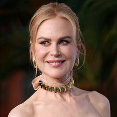 Nicole Kidman looks away from the camera smiling