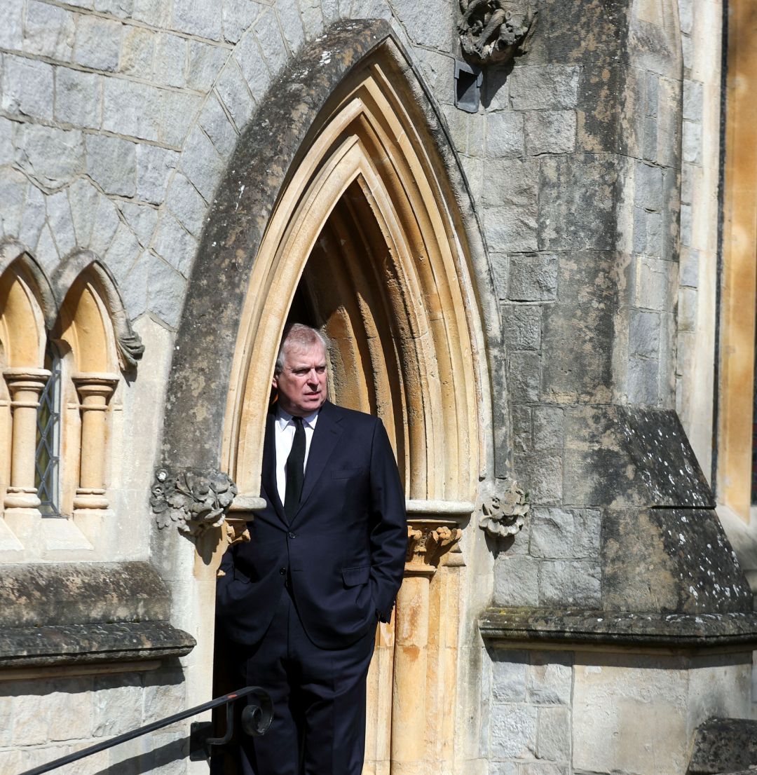 Prince Andrew standing in the archway of the chapel at Royal Lodge