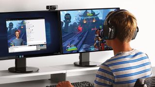 A boy using the Logitech C922 Pro webcam attached to a monitor
