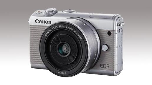 Canon EOS M100 against a grey background