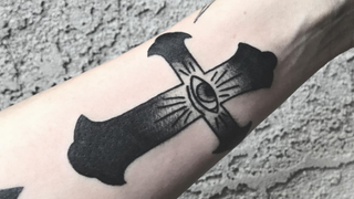 Shaded cross tattoo